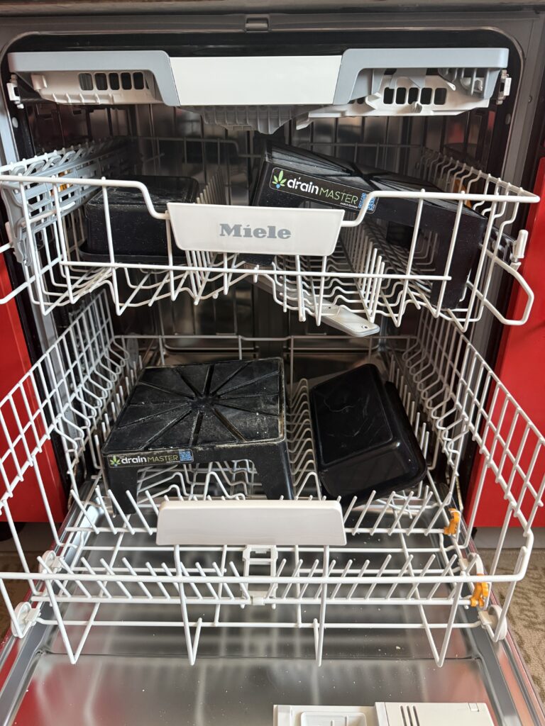 DrainMaster Drip Stand and bowl in a Miele dishwasher, ready for cleaning